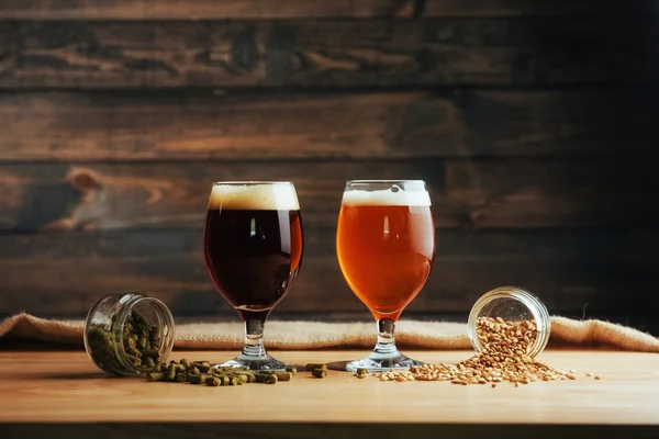 Two Glasses Beer Wooden Table Grains Hops — Stock Photo, Image