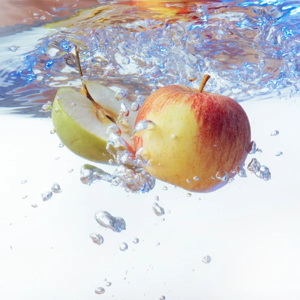 Apple in water on a white background — Stock Photo, Image