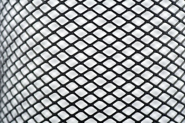 Beyaz bir arka planda kesintisiz siyah mesh — Stok fotoğraf