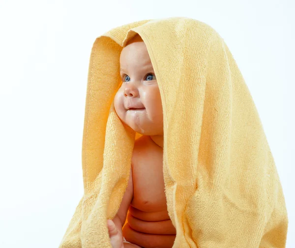 Baby in yellow towel — Stock Photo, Image