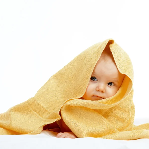 Baby in yellow towel — Stock Photo, Image