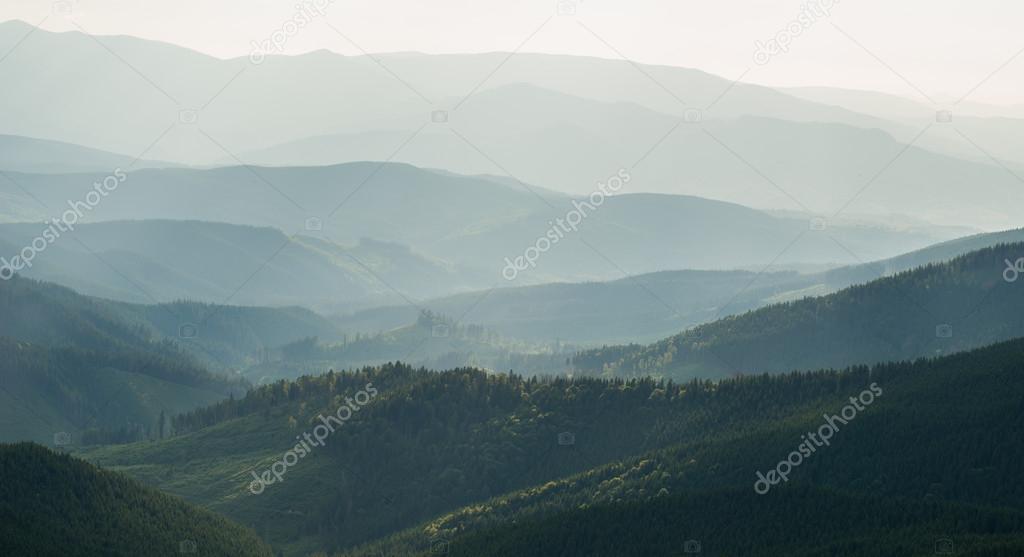 View of misty fog mountains in autumn