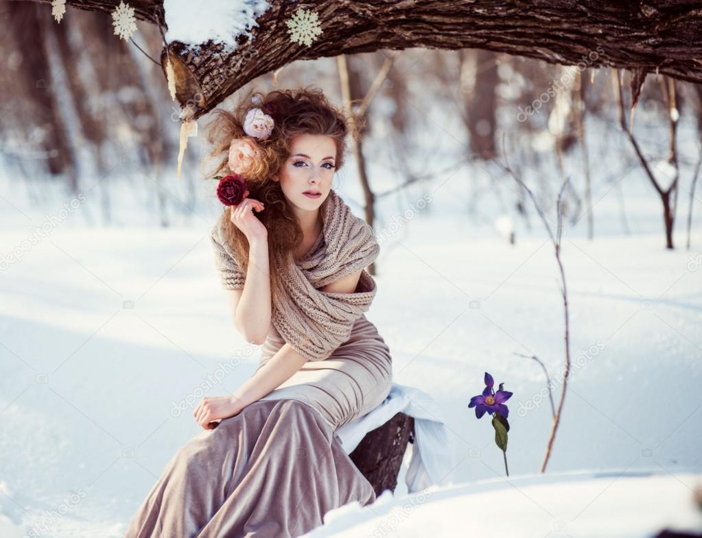 beautiful girl in the winter forest 