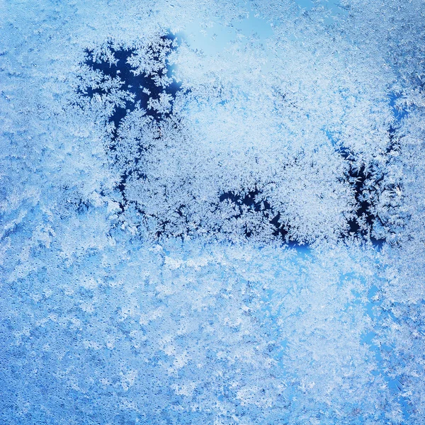 Texture of patterns on frozen window glass — Stock Photo, Image