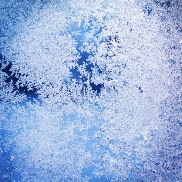 Texture of patterns on frozen window glass — Stock Photo, Image