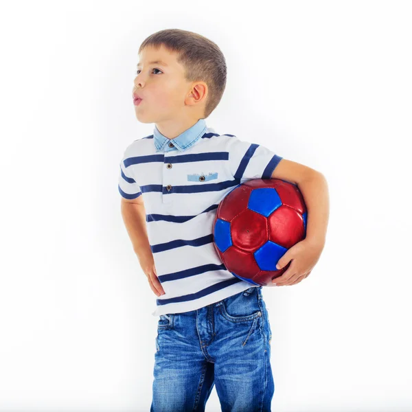 Caucasian boy holding a soccer ball and whistle — Stock Photo, Image