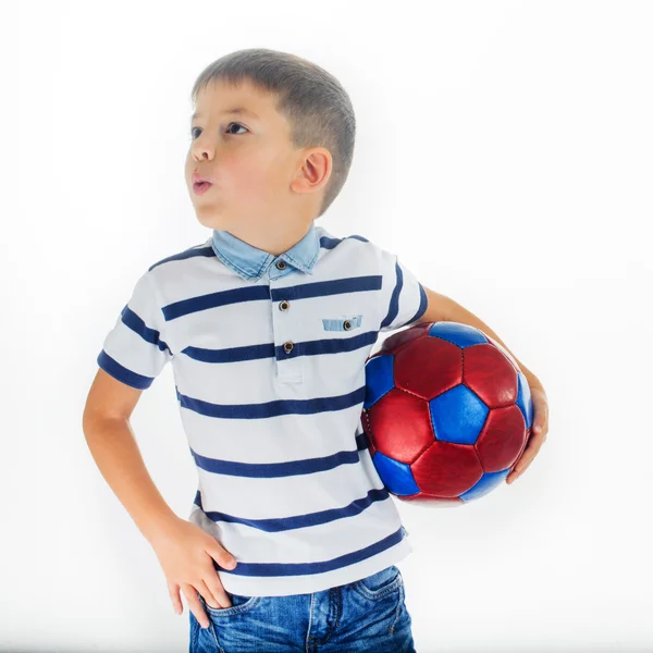 Caucasian boy holding a soccer ball and whistle — Stock Photo, Image