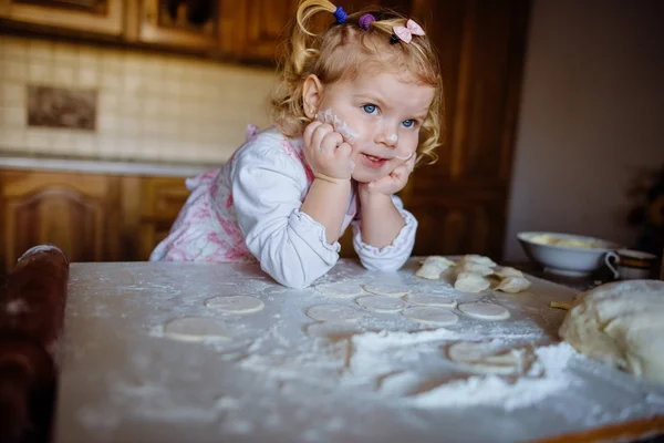 Baker girl in chef hat at kitchen — Stock Photo, Image