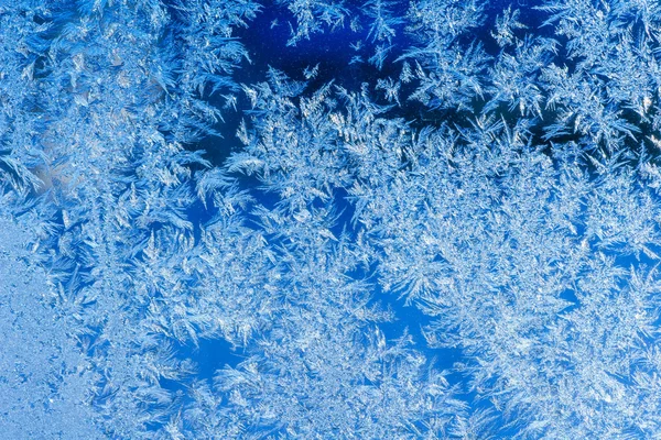 Texture of patterns on frozen window glass — Stock Photo, Image