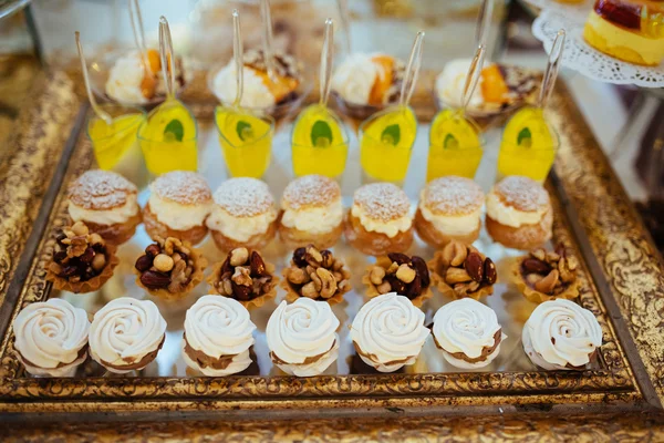 Many servings of sweet tasty dessert on buffet — Stock Photo, Image