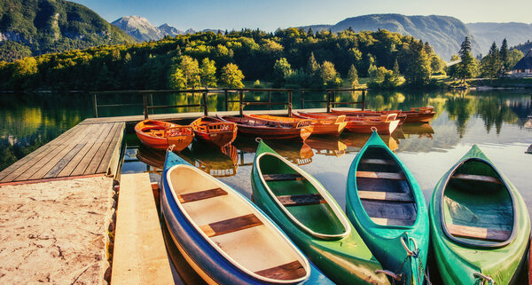 Boat on the dock surrounded mountains. Fantastic Shtrbske Pleso 