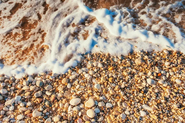 Kiezelstenen op het strand — Stockfoto