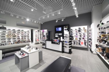 interior of shoe store in modern european mall clipart