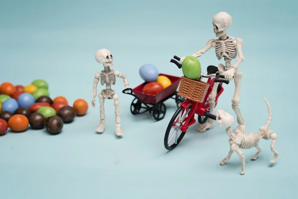 Skeletons and chocolate candy — Stock Photo, Image