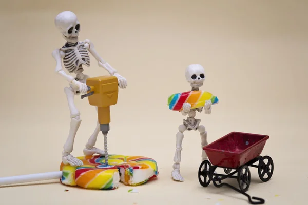 Skeletons moving lollipop — Stock Photo, Image