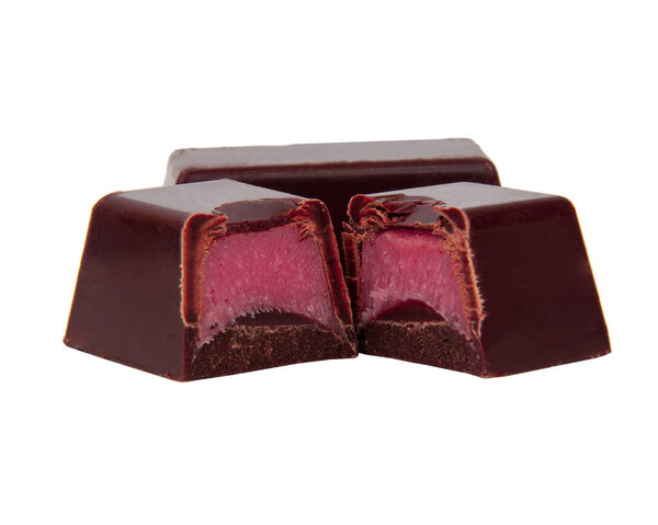 Chocolate sweets with pink strawberry filling praline isolated on the white