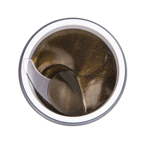 Beyaz arka planda izole edilmiş kutudaki koyu kozmetik göz bantları