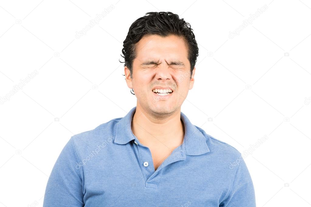 Painful Facial Expression Hispanic Male Grimacing