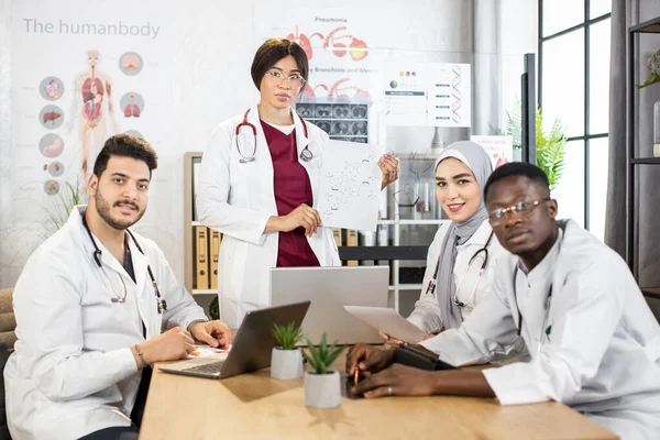 Diverse medical specialists using gadgets during conference — Stock Photo, Image