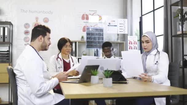 Diverse doctors throwing up papers after meeting — Stock Video