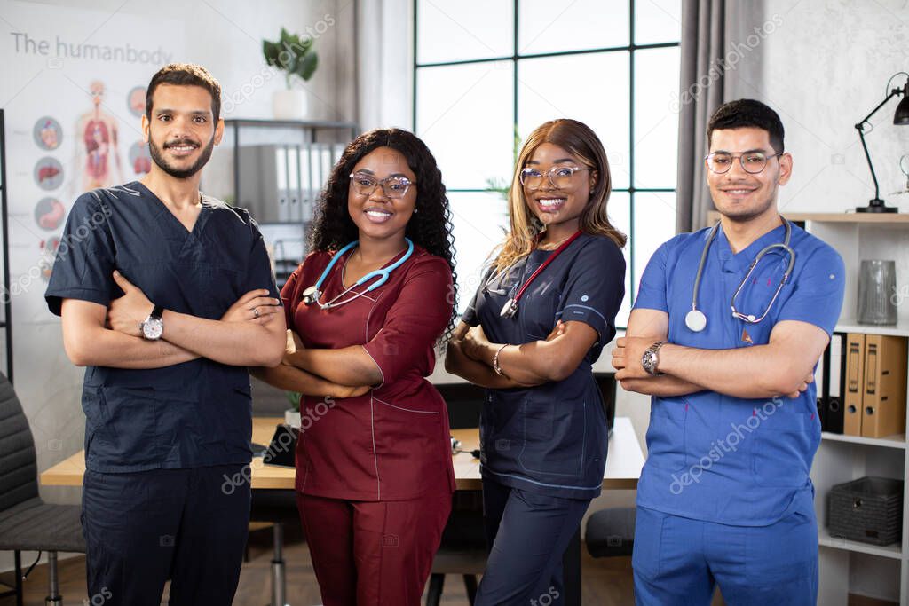 Diverse multiethnic cheerful medical team at work in hospital