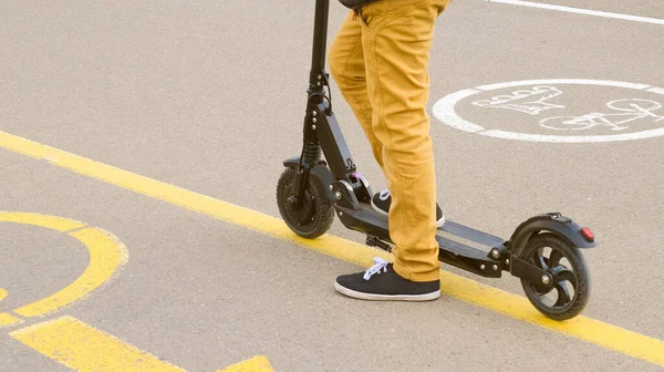 Back View Legs Boy Yellow Pants Black Gumshoes Scooter Close — Stock Photo, Image