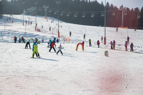 Ski park in Poland. New Year. People skiing, go on chair lift. Concept of sport, family rest , healthy lifestyle. —  Fotos de Stock