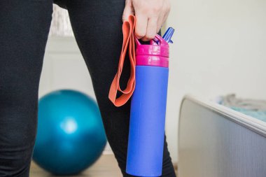 Morning home workout. at home training with rubber bands.Concept of activating the muscles of the buttocks and thighs