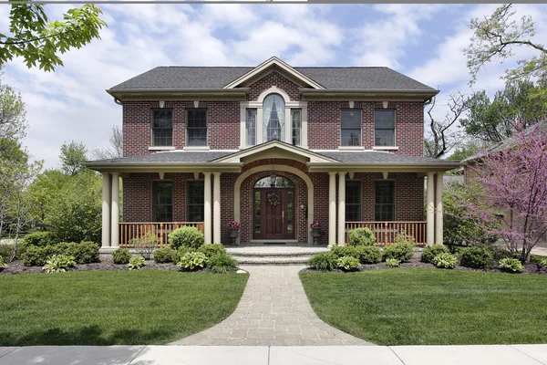 Brick home with white columns — Stock Photo, Image