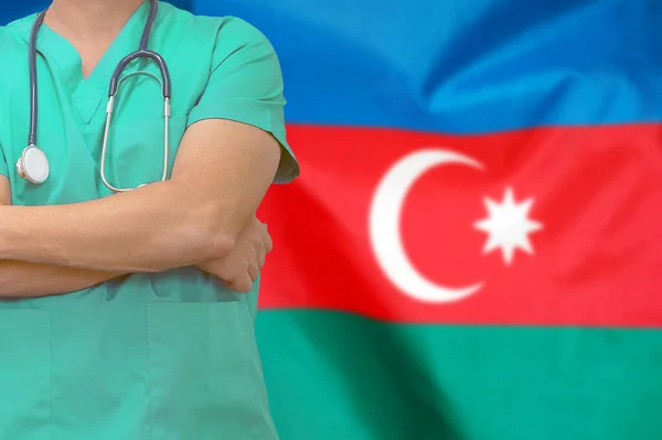 Male surgeon or doctor with stethoscope on the background of the Azerbaijan flag. Health care and medical concept. Surgery concept in Azerbaijan