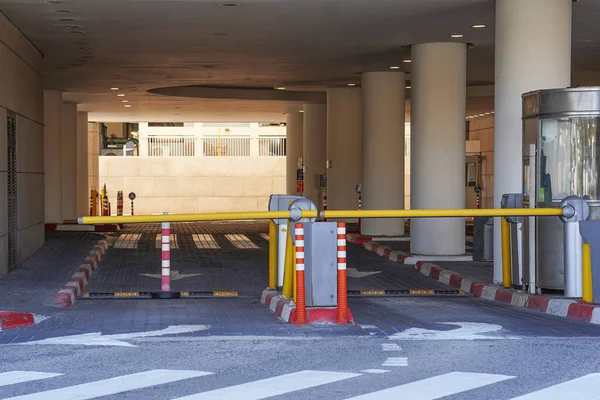 Barrier at Entrance and exit of a car Parking garage. barrier in a car park. Exit from underground parking. Underground parking, garage. Interior of parking