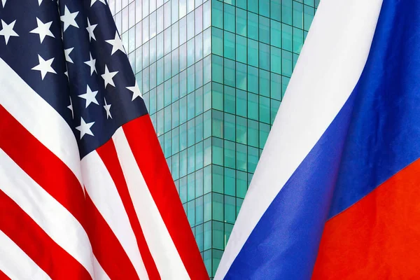 Flag of USA and Russia flag close-up. The concept of political and economic relations of states. Sanctions