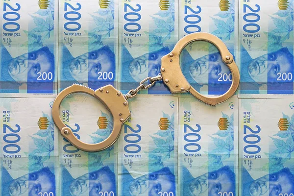 Handschellen Auf Dem Hintergrund Israelischen Geldes Polizeihandschellen Finanzkriminalität Schmutziges Geld — Stockfoto