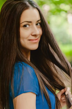 Young beautiful caucasian female with long dark hair
