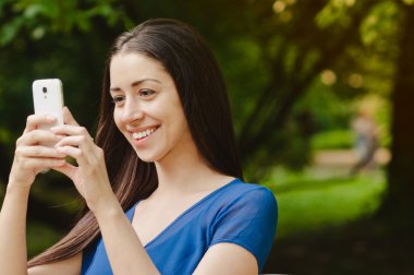 Girl taking a picture with her phone