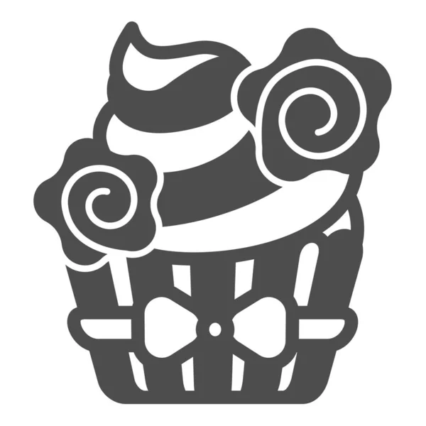 Cupcake with whipped cream and flower deco with bow solid icon, pastry concept, muffin vector sign on white background, glyph style icon for mobile concept and web design. Vector graphics. — Stock Vector