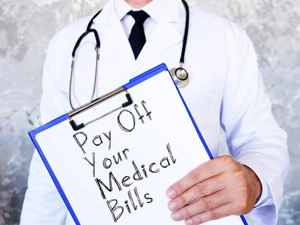 Оплатити ваші медичні рахунки показано на бізнес фотографії за допомогою тексту — стокове фото