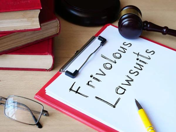 Frivolous lawsuits is shown on the conceptual photo using the text — Stock Photo, Image