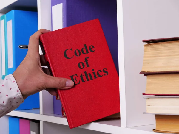 Code of Ethics is shown on a photo using the text