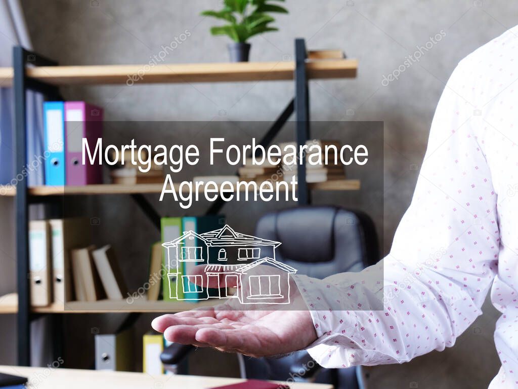 Mortgage forbearance agreement is shown on a business photo using the text