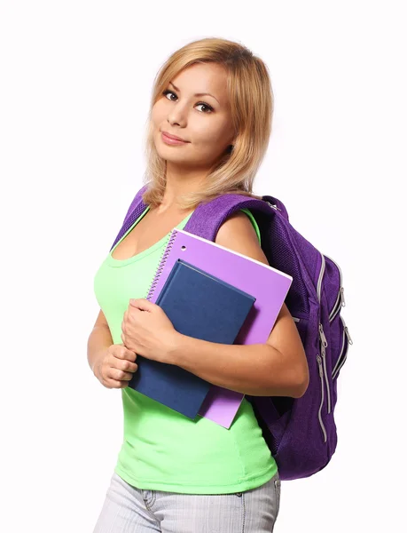 Schülerin mit Rucksack und Büchern isoliert auf weißem Grund — Stockfoto