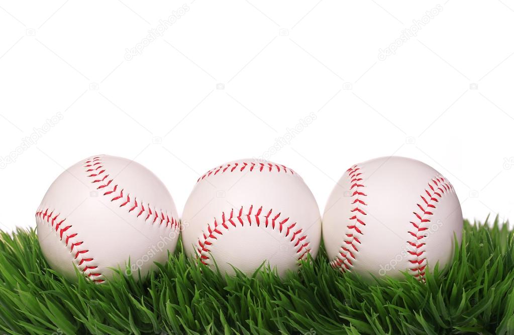Baseball. Balls on Green Grass isolated on white