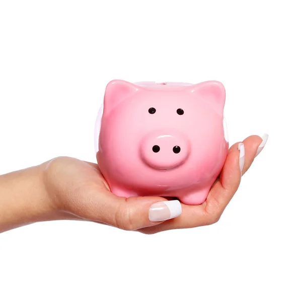 Piggy bank in vrouwelijke hand geïsoleerd — Stockfoto