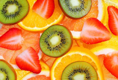 dilimlenmiş meyve. arka plan. çilek, kivi, ananas