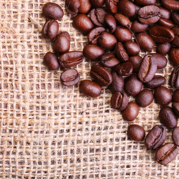 Kaffebønner på ærme - Stock-foto