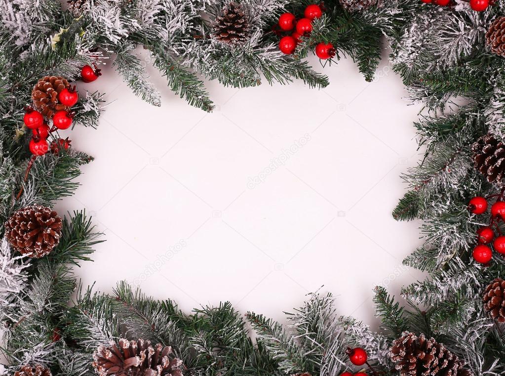 Christmas decorative border with pine cones and holly berries