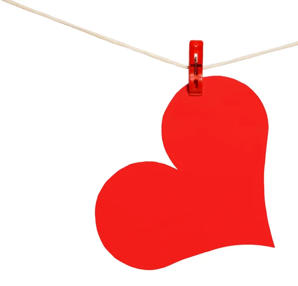 Red heart hang on clothesline isolated on white. Valentine's Day — Stock Photo, Image