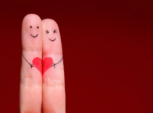 Happy Couple Concept. Two fingers in love with painted smiley fa Stock Photo