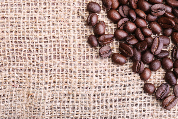 Coffee Beans on Burlap Background