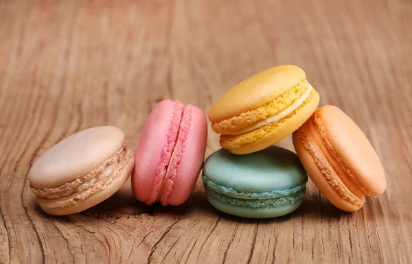 Colorful French Macaroons on wooden background — Stock Photo, Image